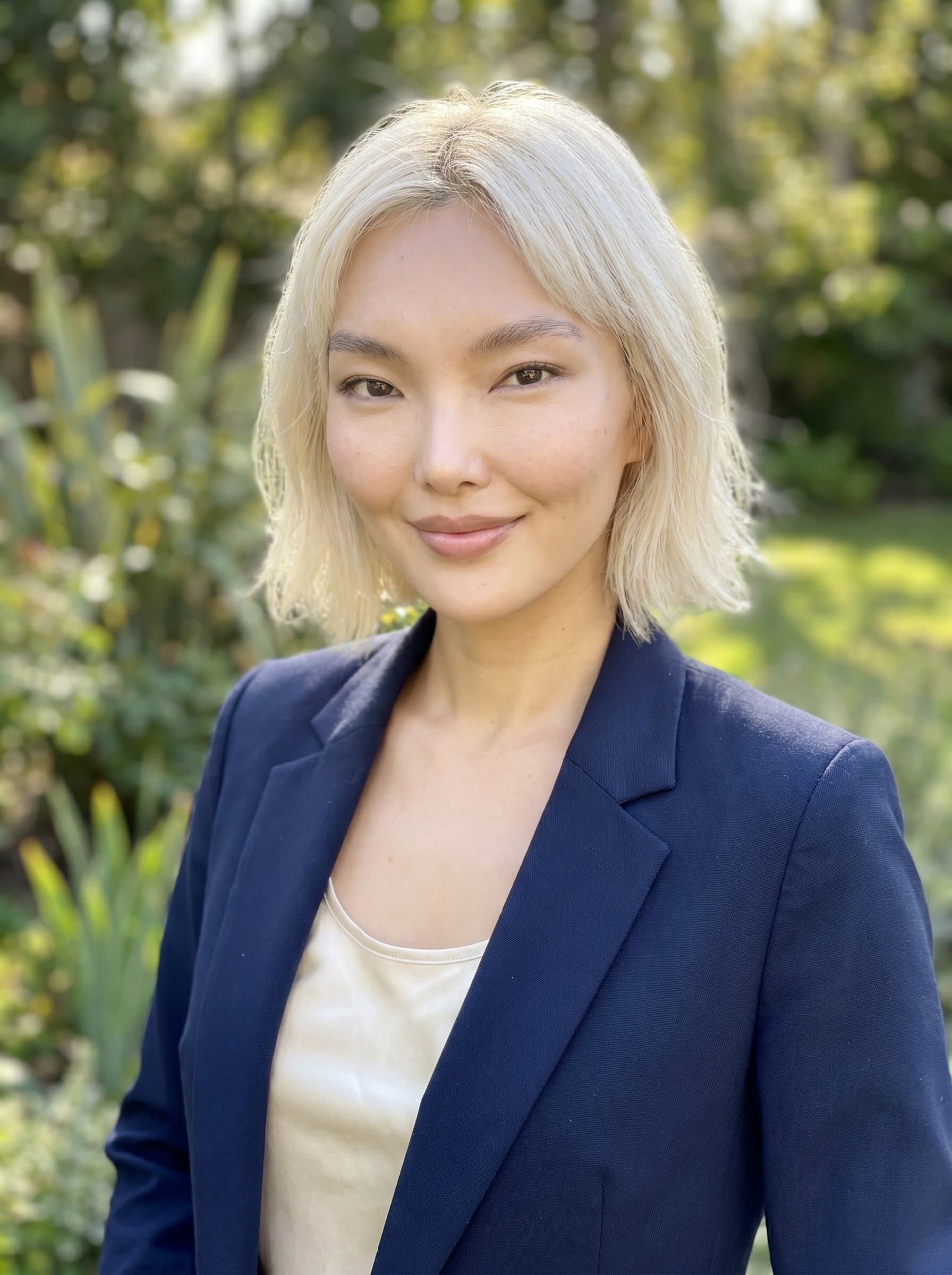 in business casual attire, closed-lip smile, natur